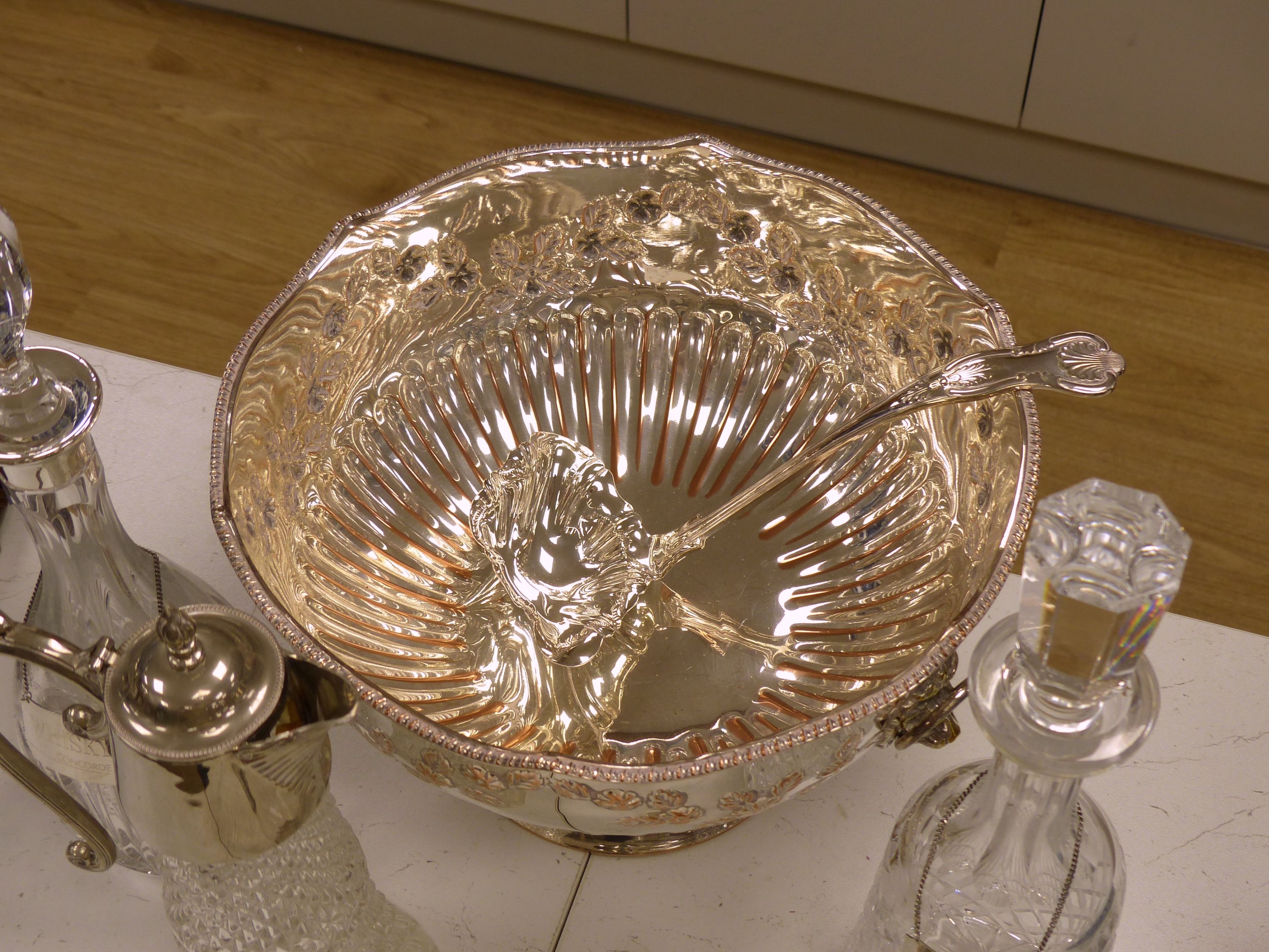Two cut glass decanters (one silver-mounted), two silver Whisky and Gin labels, an 'Etains du Manoir' duck shaped wine carafe and two other items